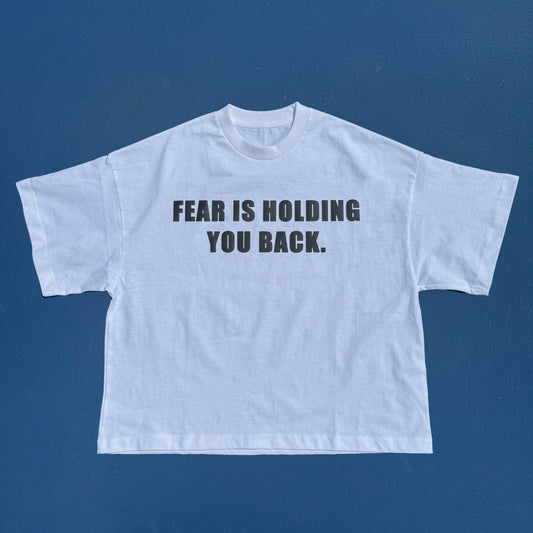 FEAR IS HOLDIN YOU BACK CROPPED TSHIRT